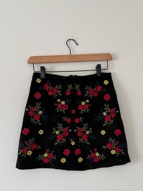 Black Suede Like Mini Skirt with Floral Embroidery (size small)